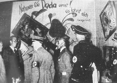 Adolf Hitler (1889-1945) and Nazi artist Adolf Ziegler (1892-1959) inspect the Degenerate Art exhibition, Munich, 1937