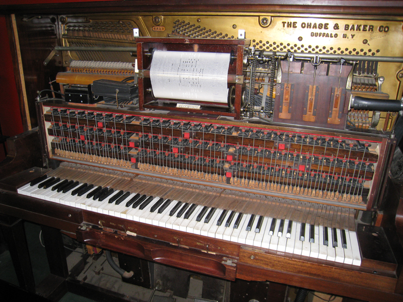 The inside of a player piano from c. 1885